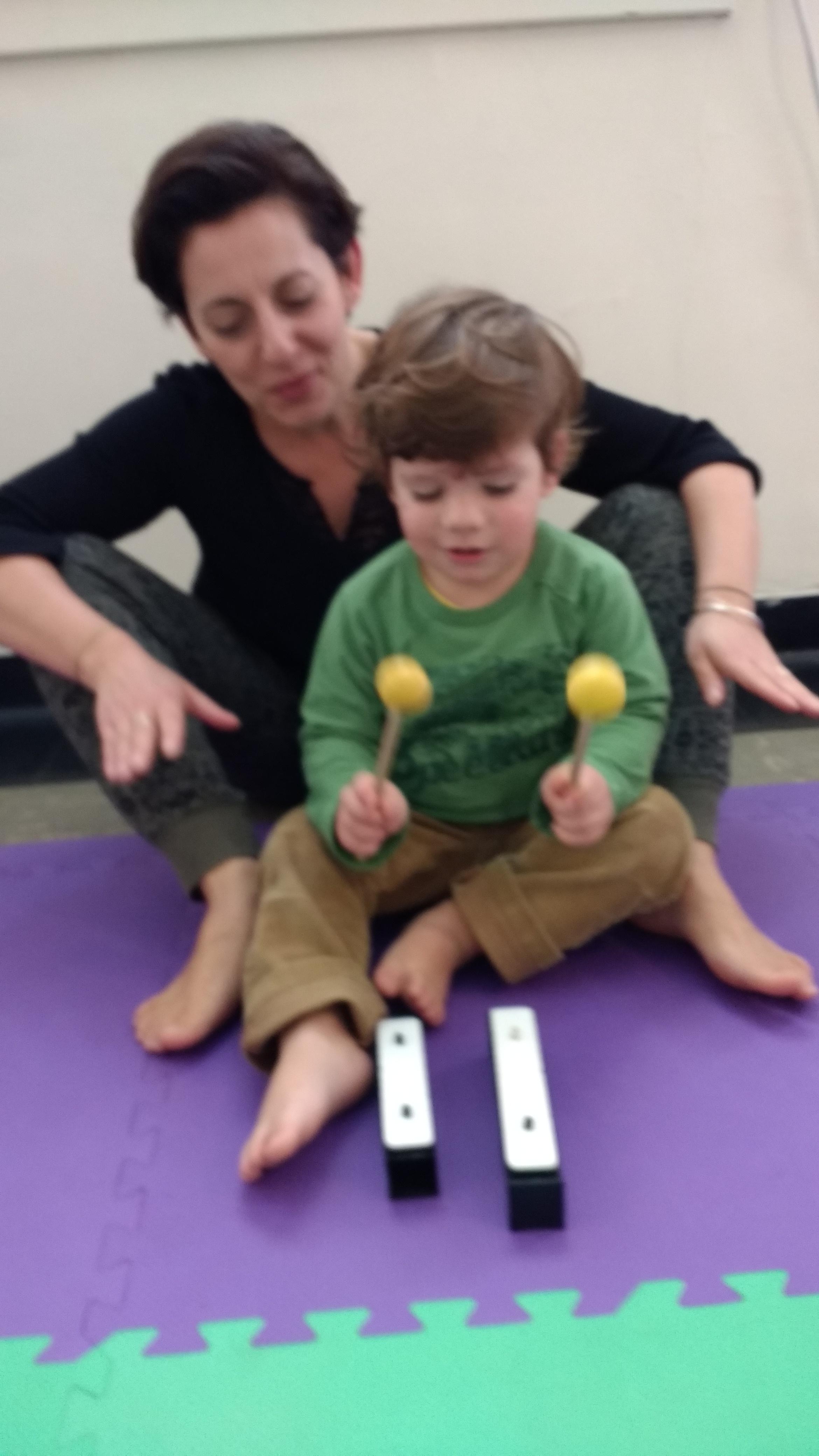 Children have a chance to explore the steady beat in a group setting.