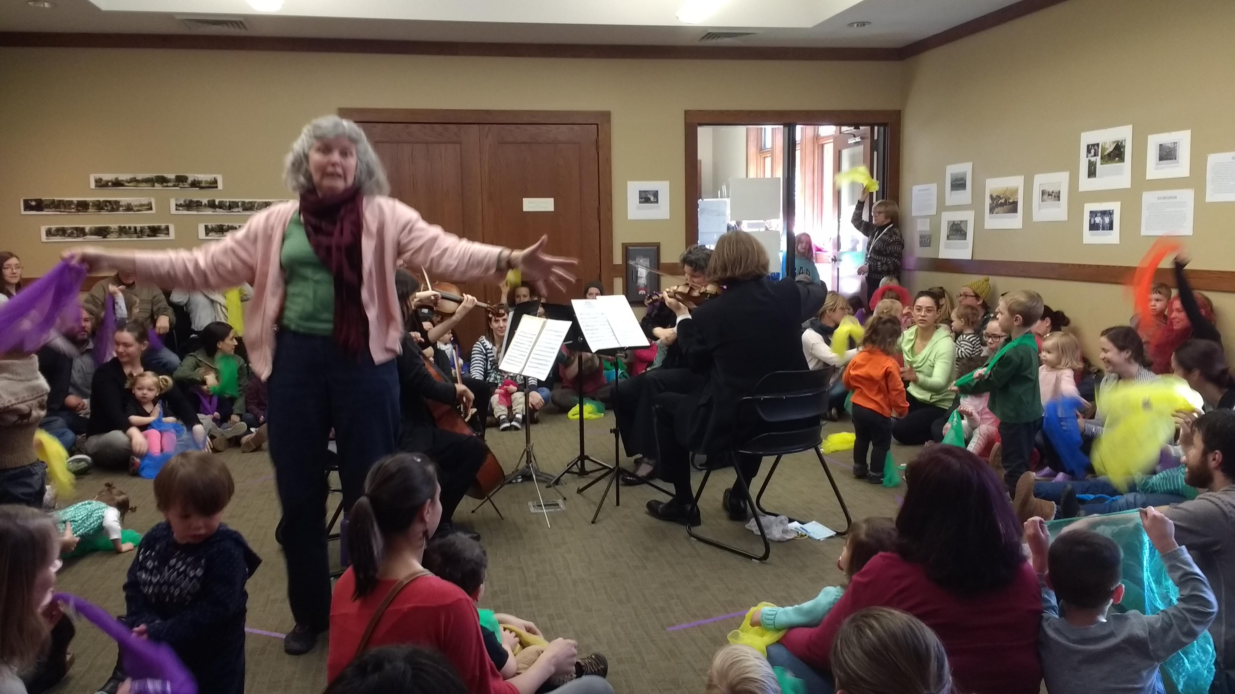 Ms. Yvette partners with the Asheville Symphony to bring a live string quartet to the library during the Asheville Amadeus Festival.